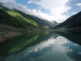 13 Lake Saiful Maluk With Malika Parbat In Kaghan Valley  Ilys drove 9km from Naran in half an hour up 770m to Lake Saiful Maluk (3200m). The overcast skies slowly parted to reveal this beautiful lake, set in alpine surroundings. The water reflects the surrounding peak of Malika Parbat (5290m).